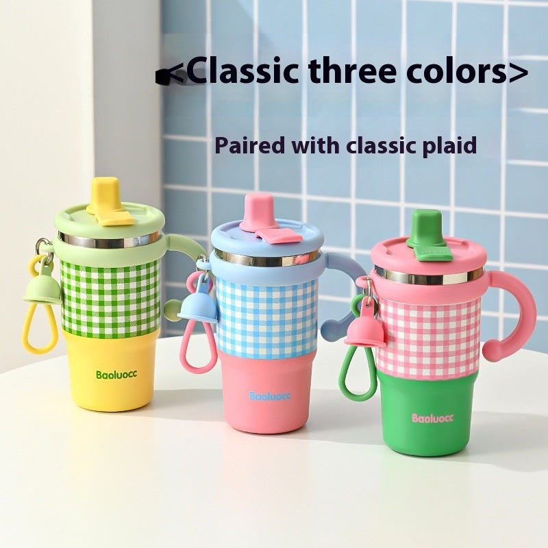 Three colorful children's cups with checkered patterns on a light surface.